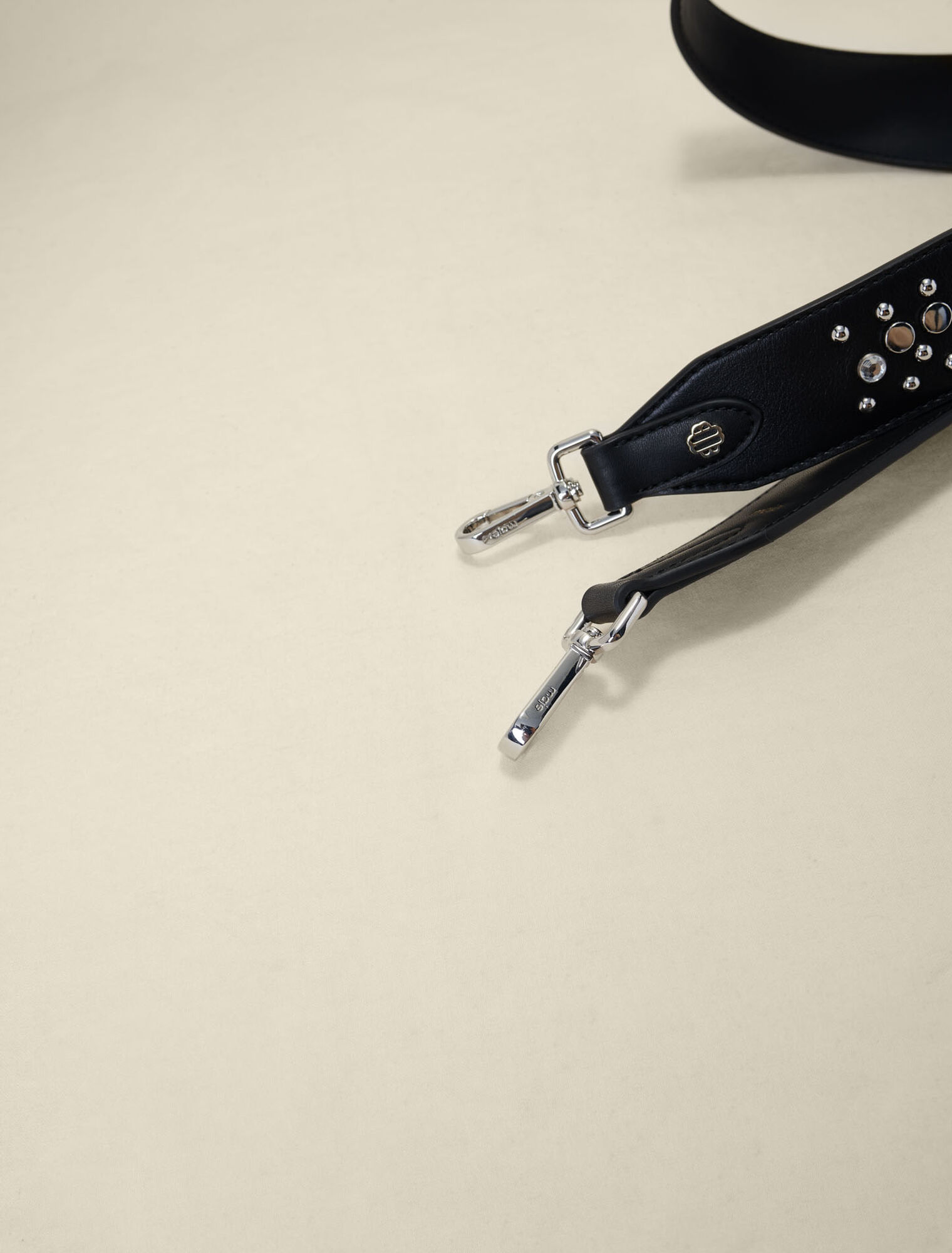 Studded leather shoulder strap