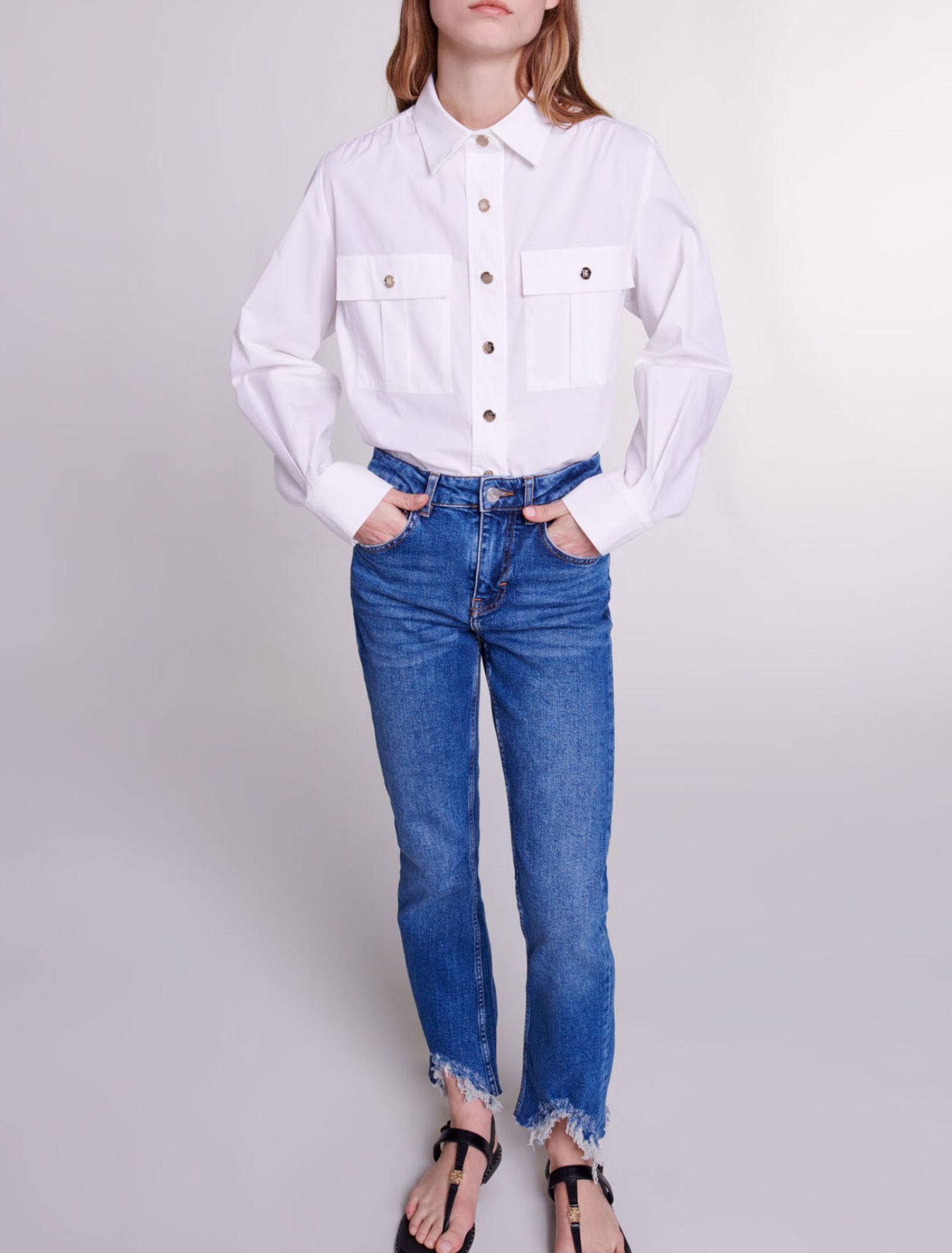 Slim-fit jeans, ripped at the bottom