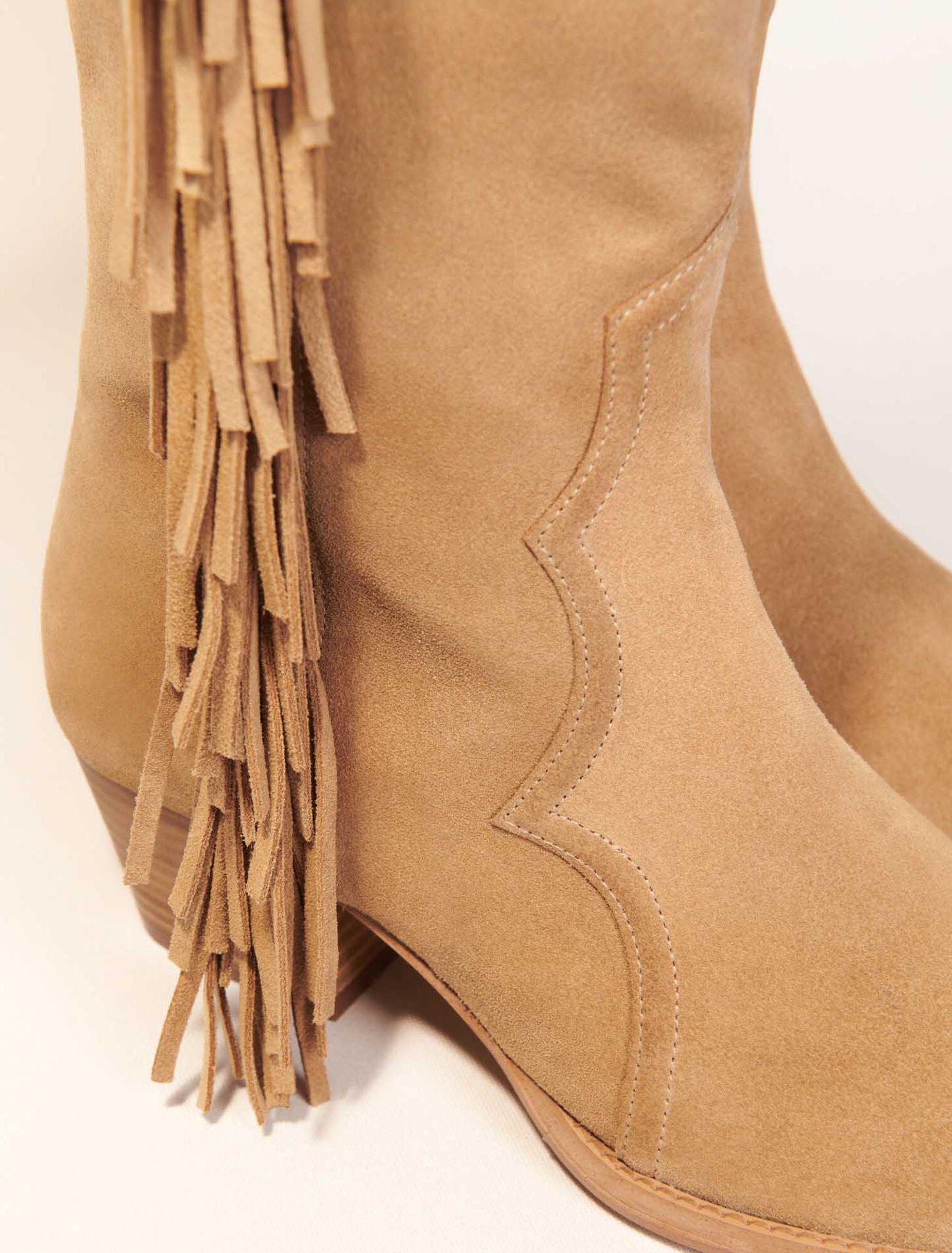 Fringed suede cowboy boots