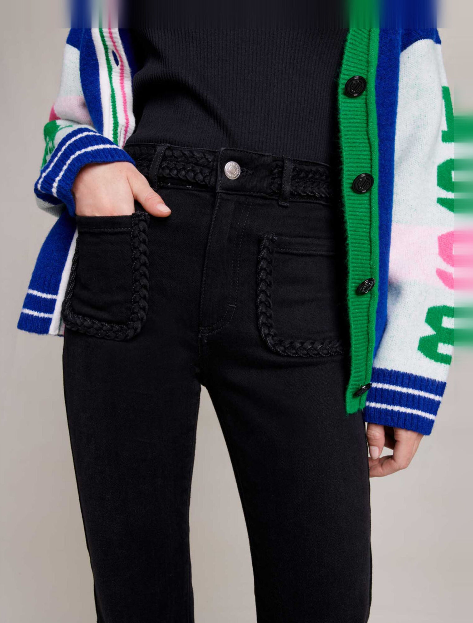 Black jeans, braided finishes on pockets