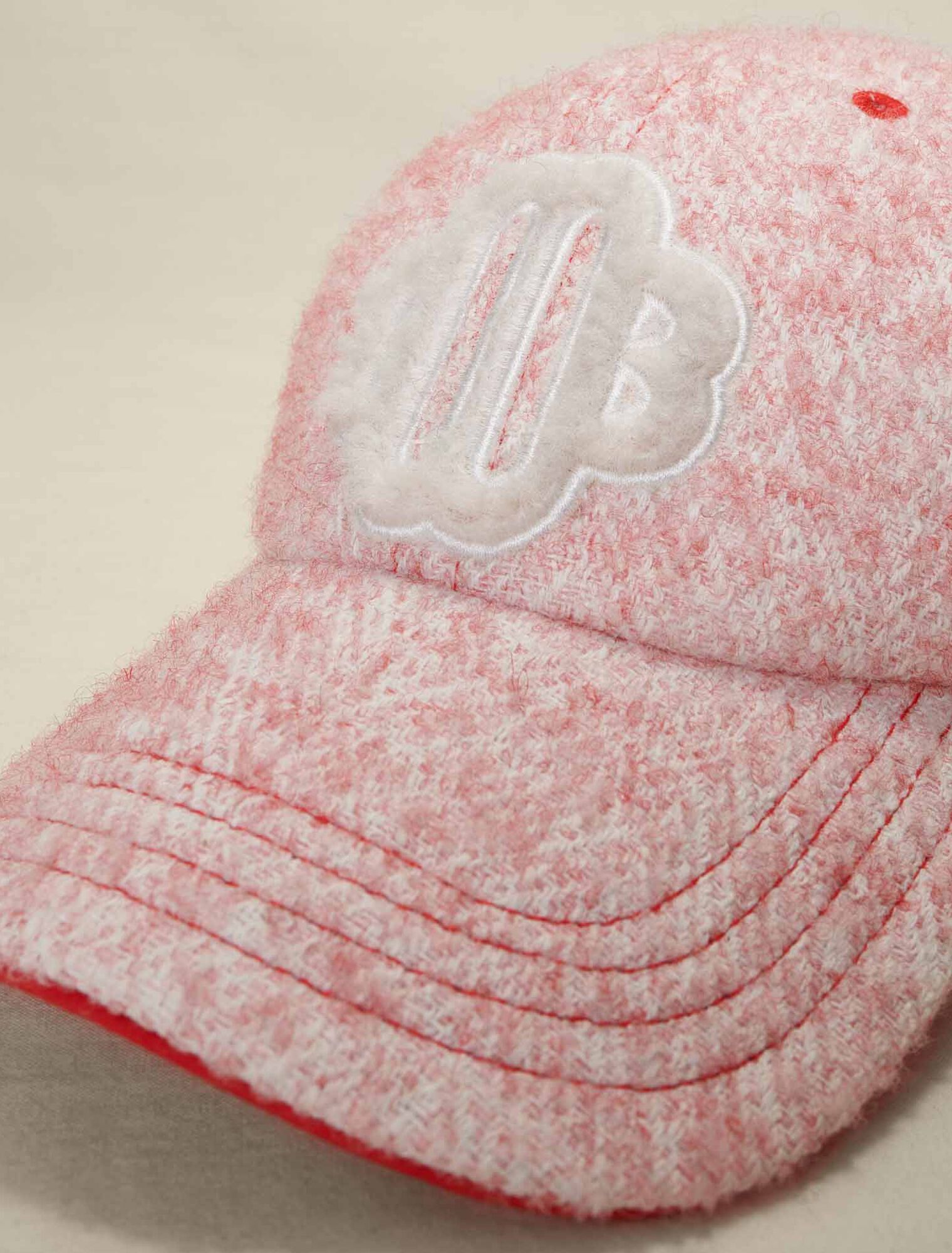 Pink tweed-effect baseball cap