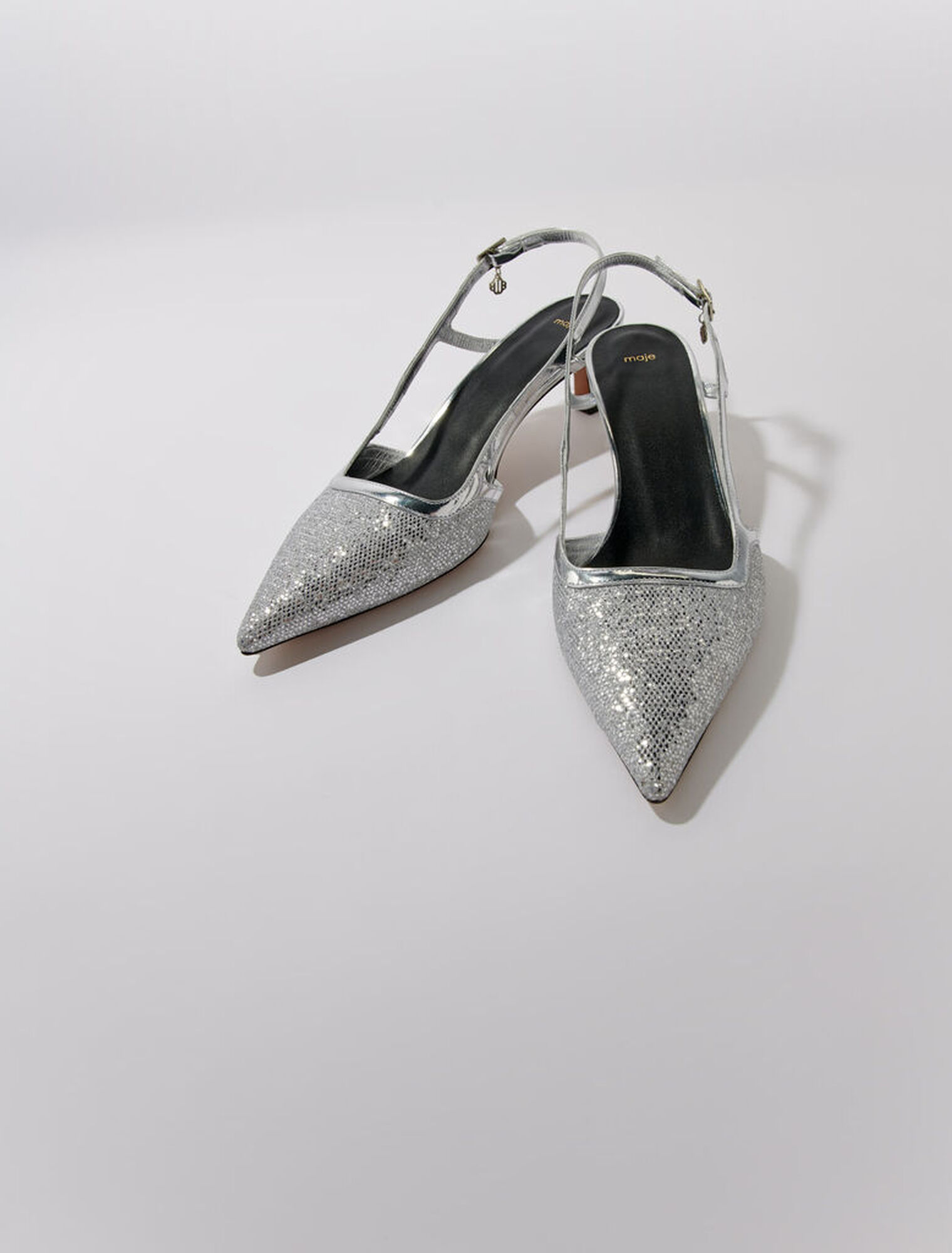 Pointed silver pumps