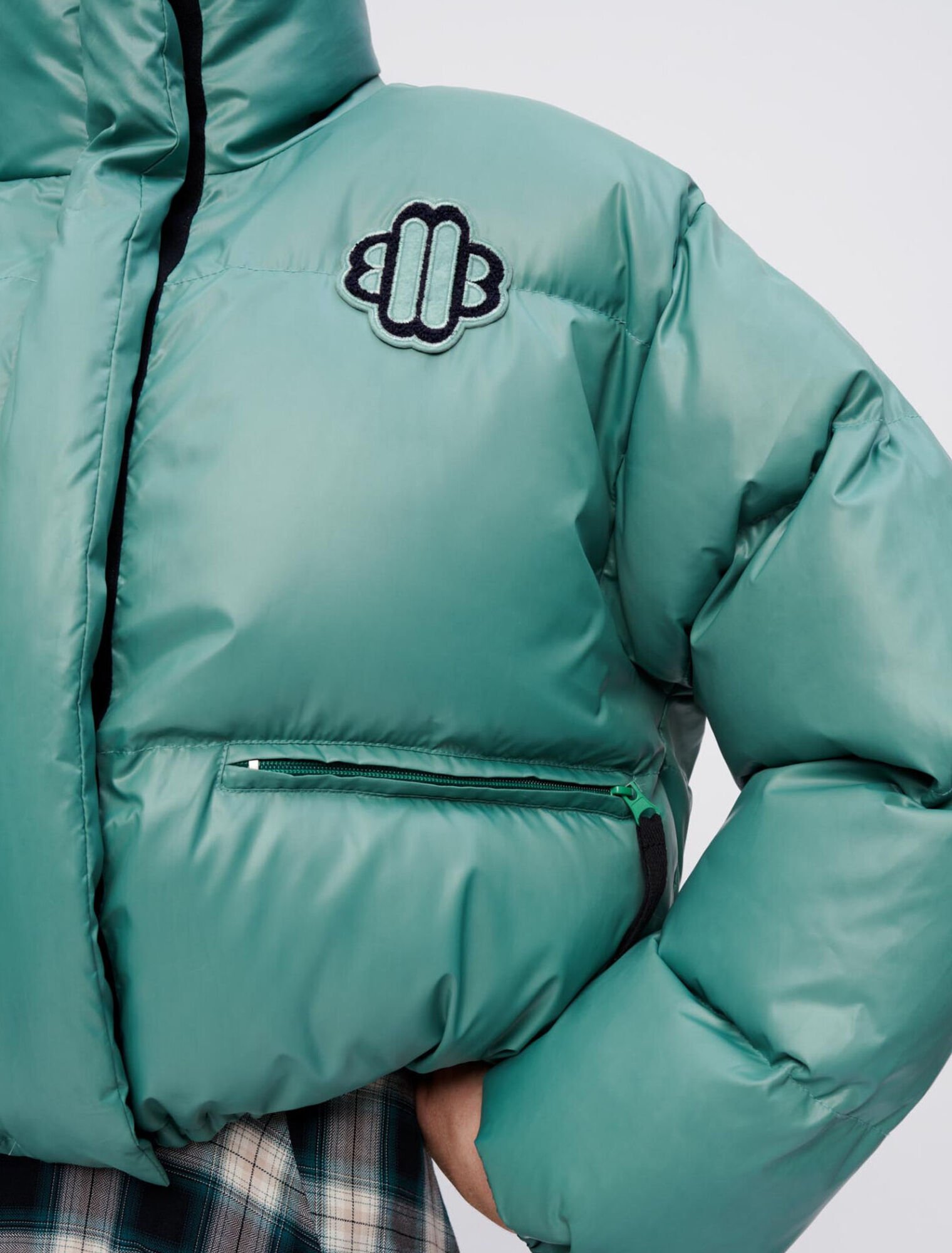 Green down jacket with Maje Clover patch
