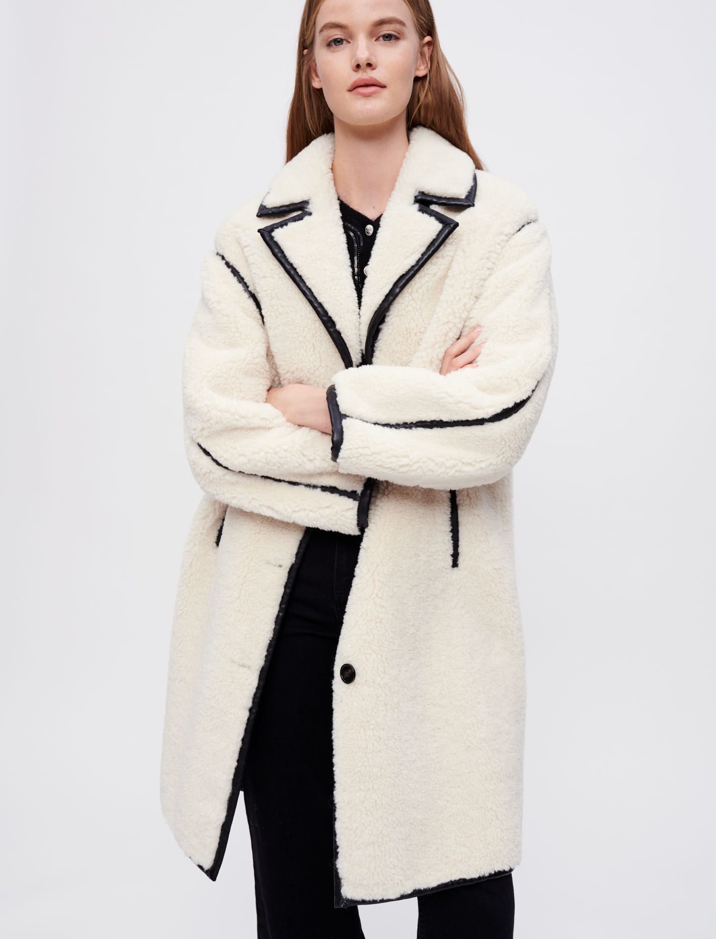 Faux sheepskin and vinyl coat