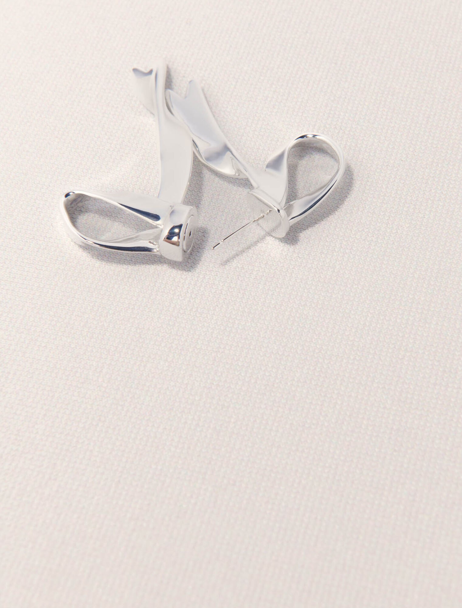 Silver bow earring
