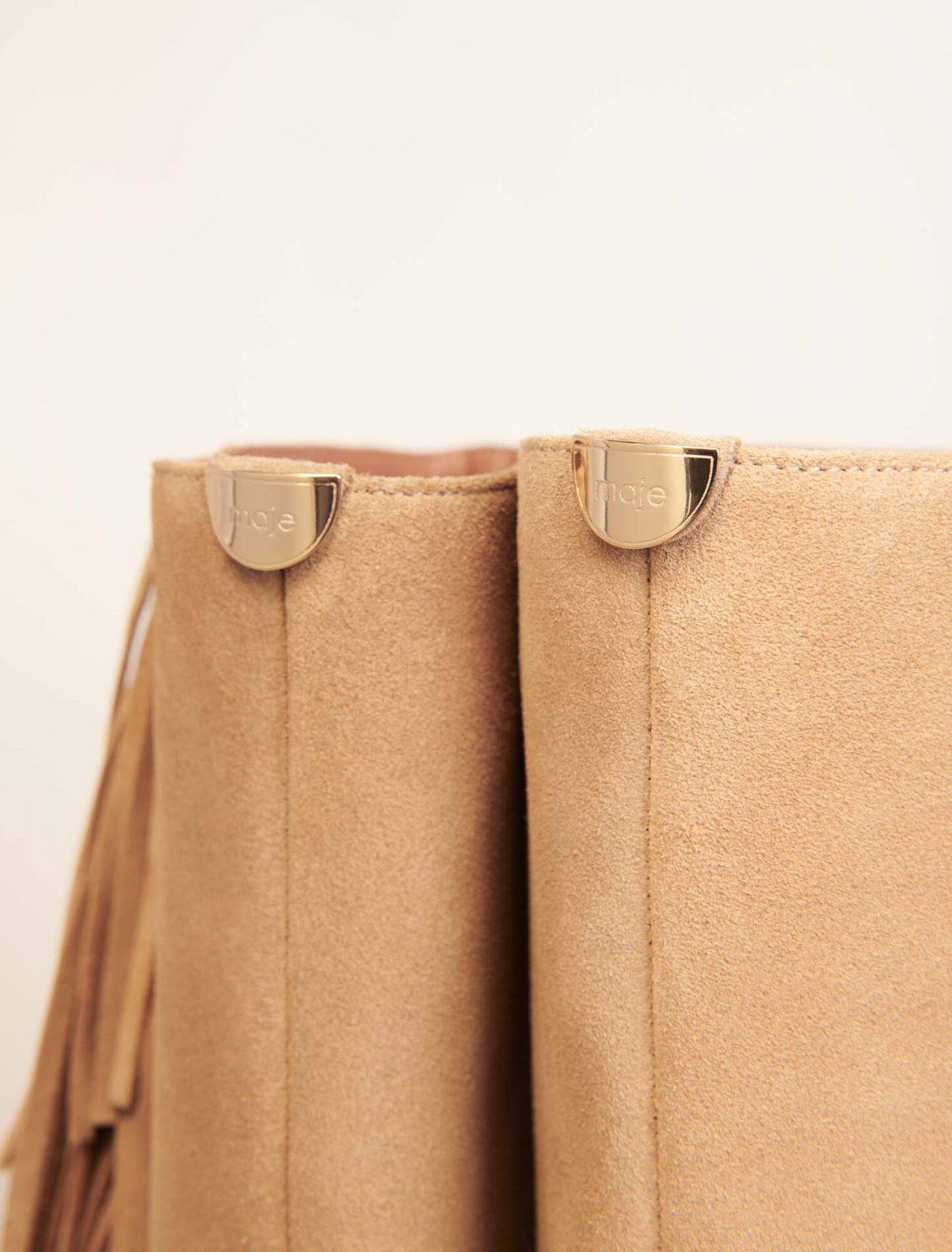 Fringed suede cowboy boots