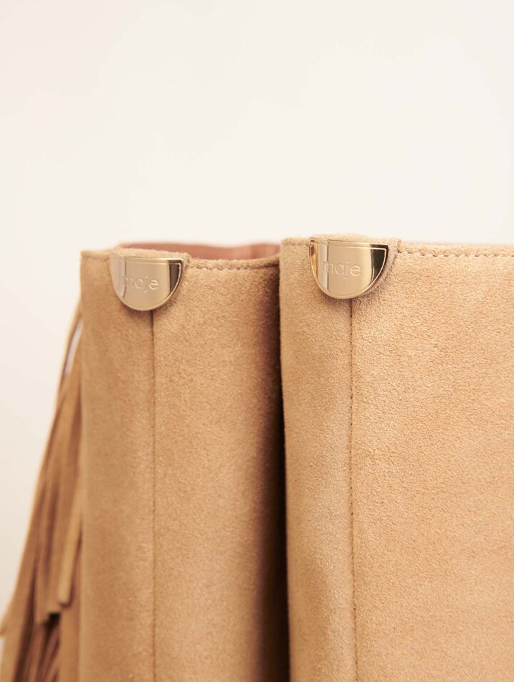 Fringed suede cowboy boots