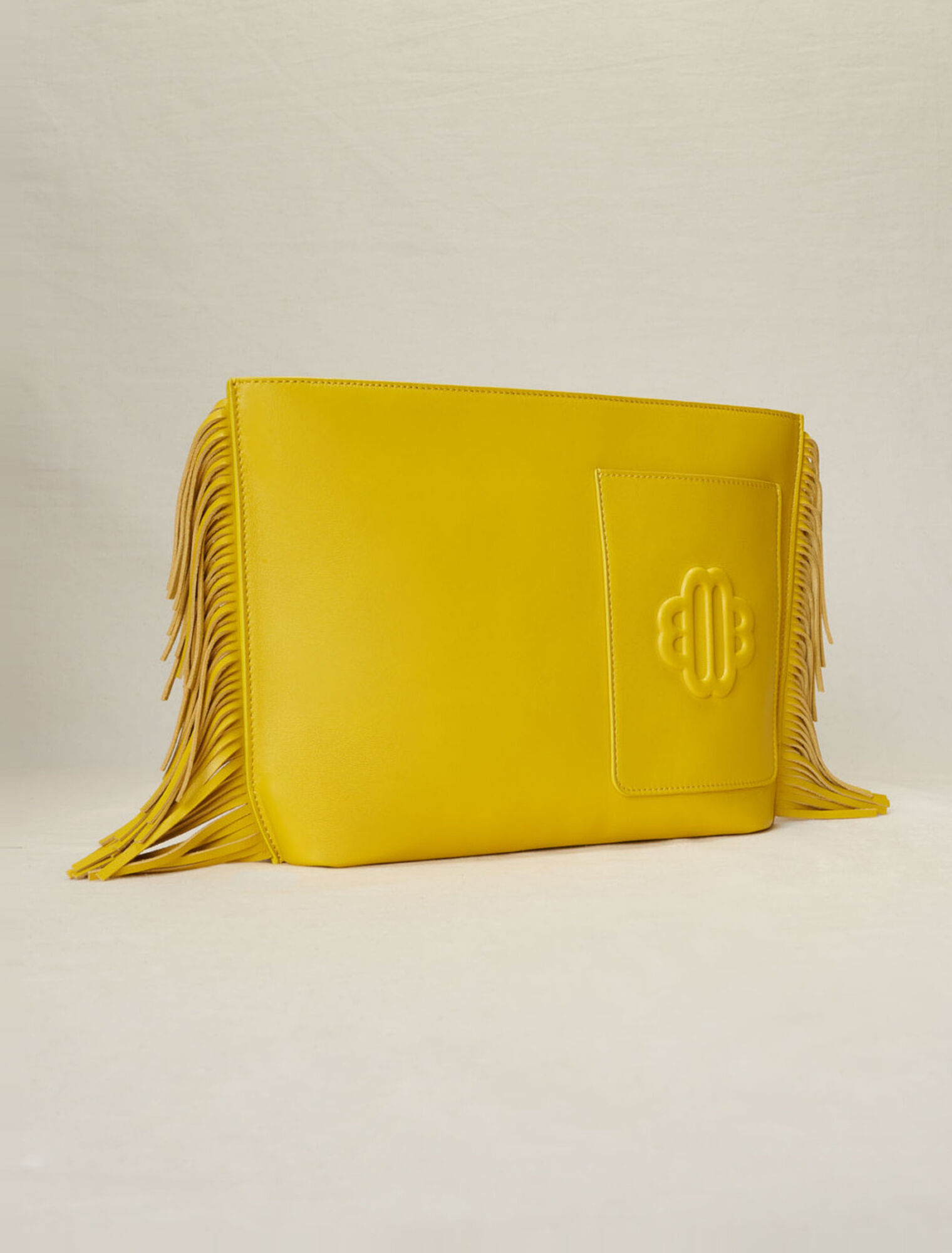 Fringed leather clutch bag