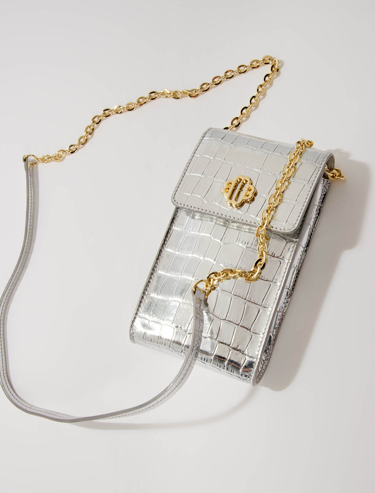 Metallic embossed leather clutch