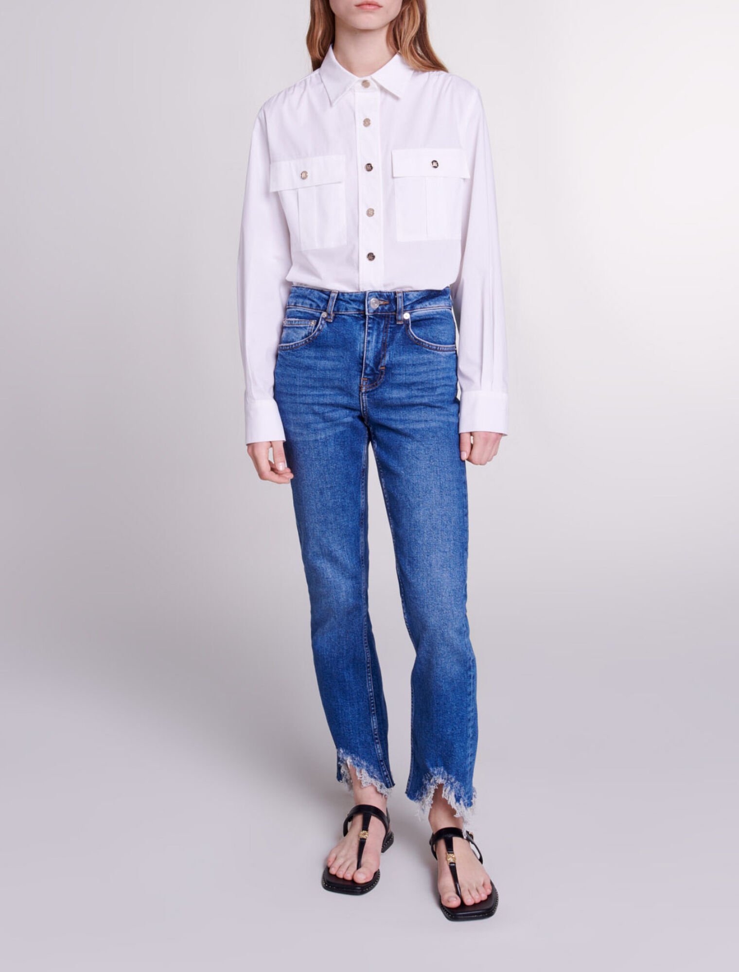 Slim-fit jeans, ripped at the bottom