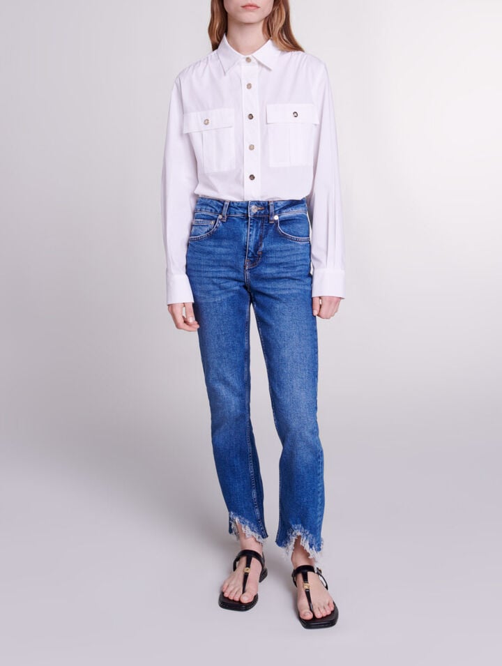 Slim-fit jeans, ripped at the bottom