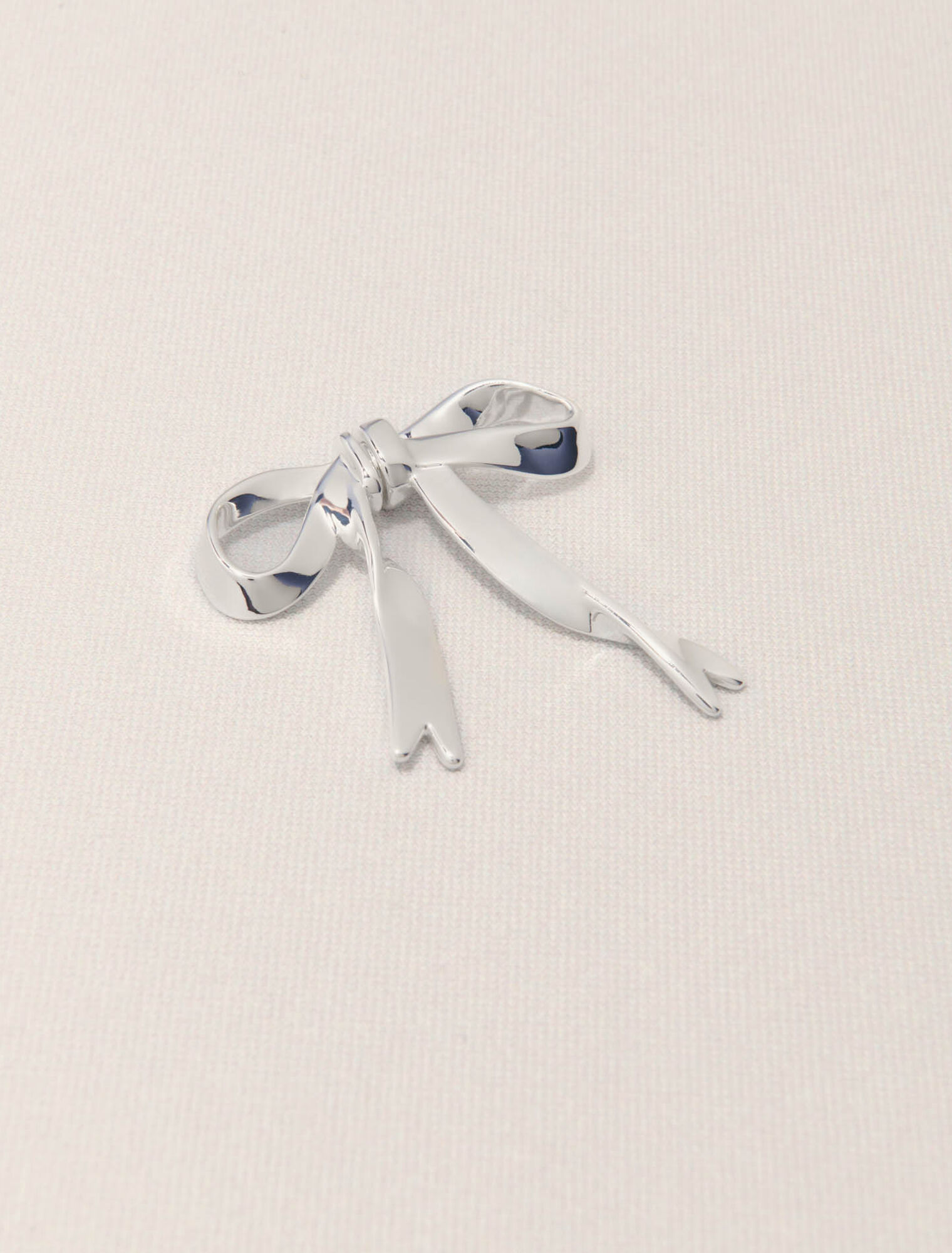 Silver bow earring