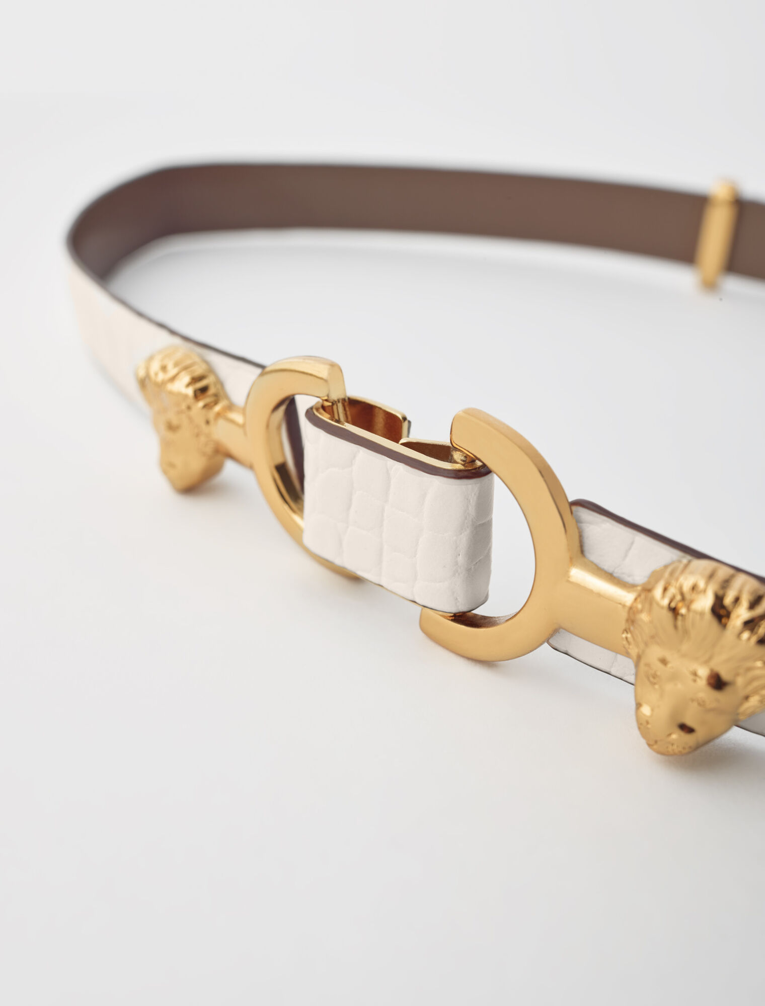 Embossed leather and lion horsebit belt