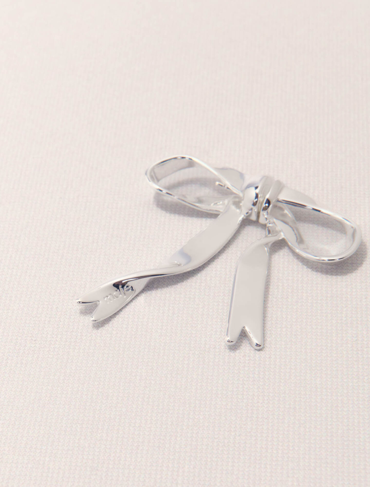 Silver bow earring
