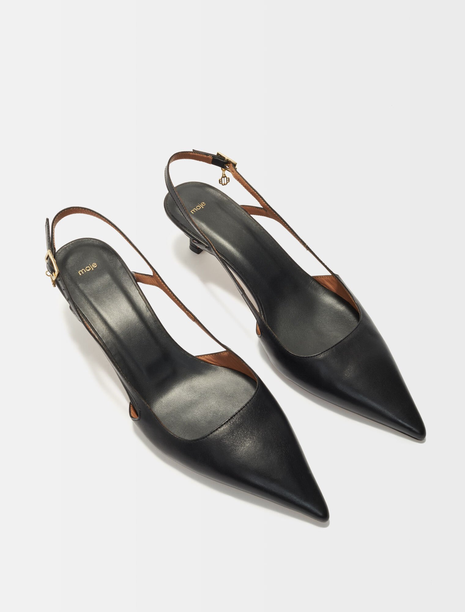 Pointed-toe pumps with straps