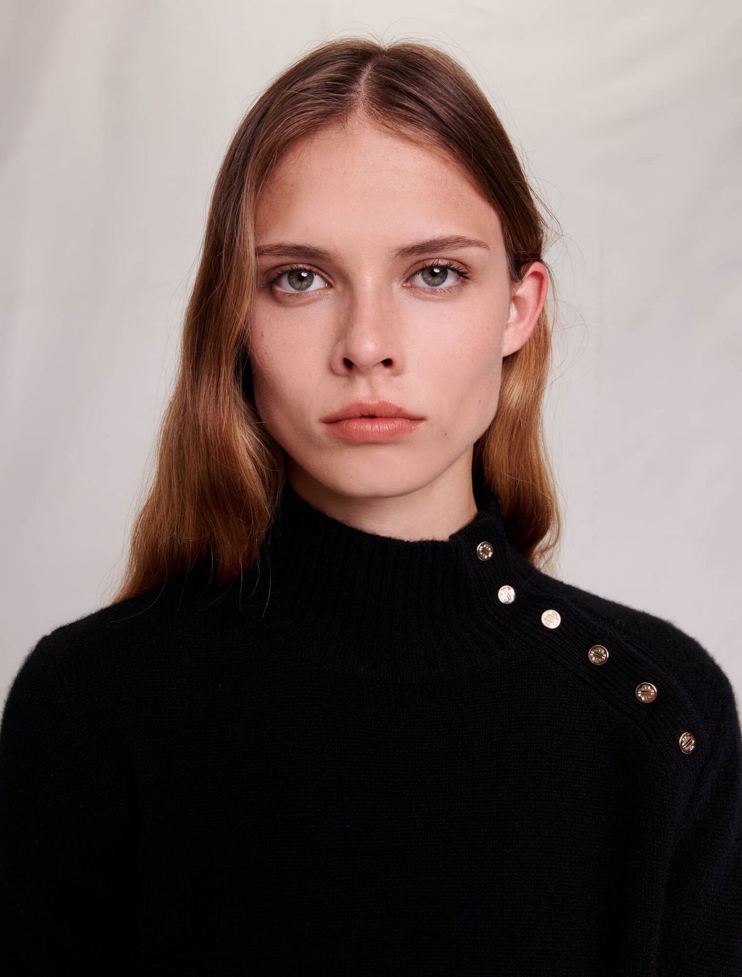 Cashmere sweater with gold snap buttons