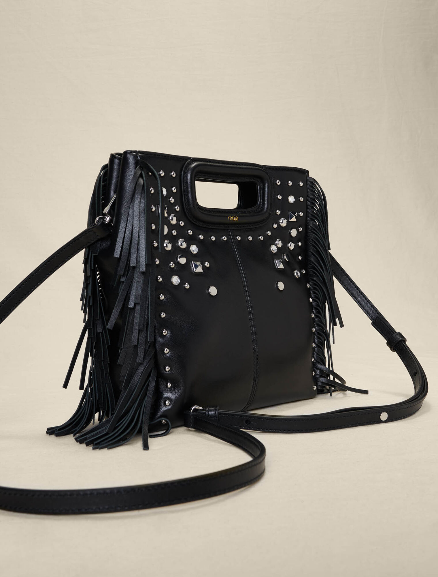 Studded leather M bag with fringing