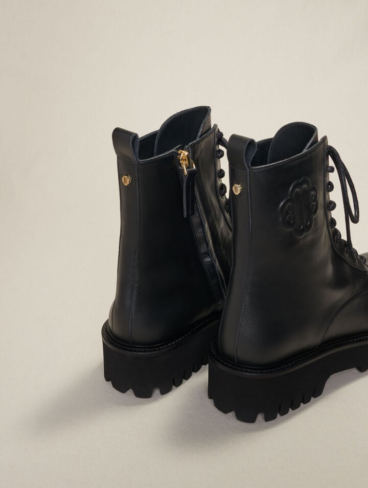 Black leather lace-up boots