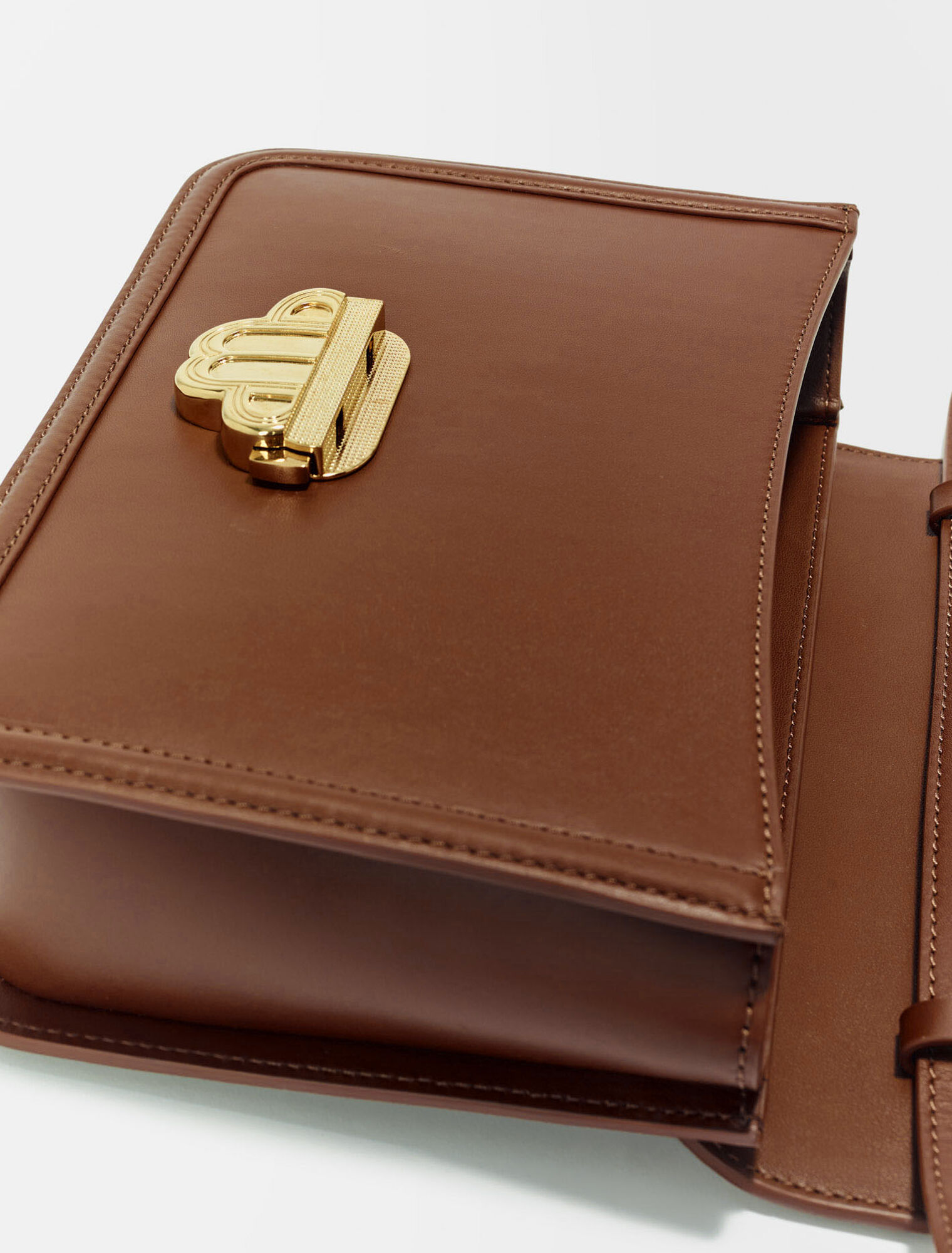 Leather bag with clover clasp
