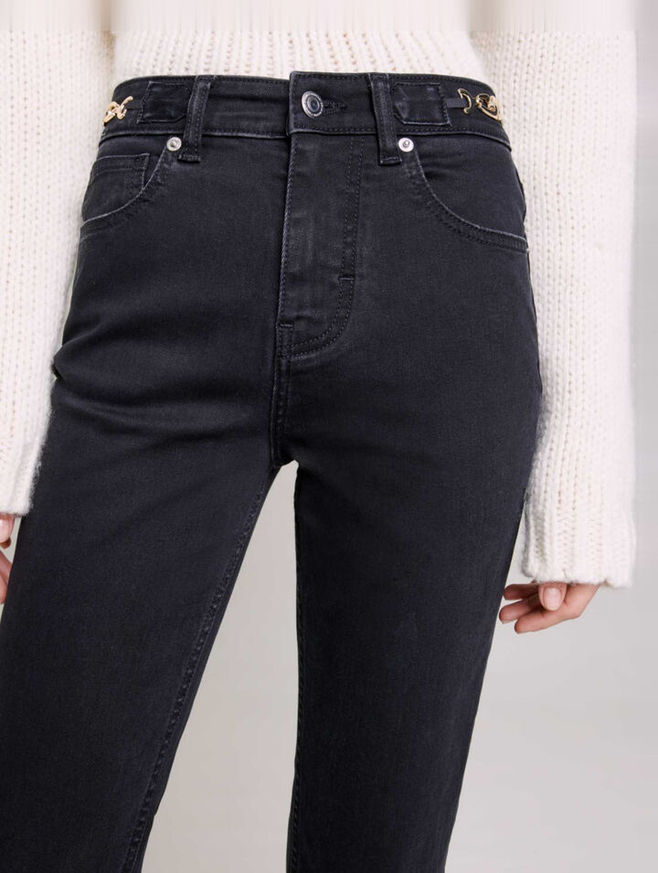 Jeans with curb chains and fringing
