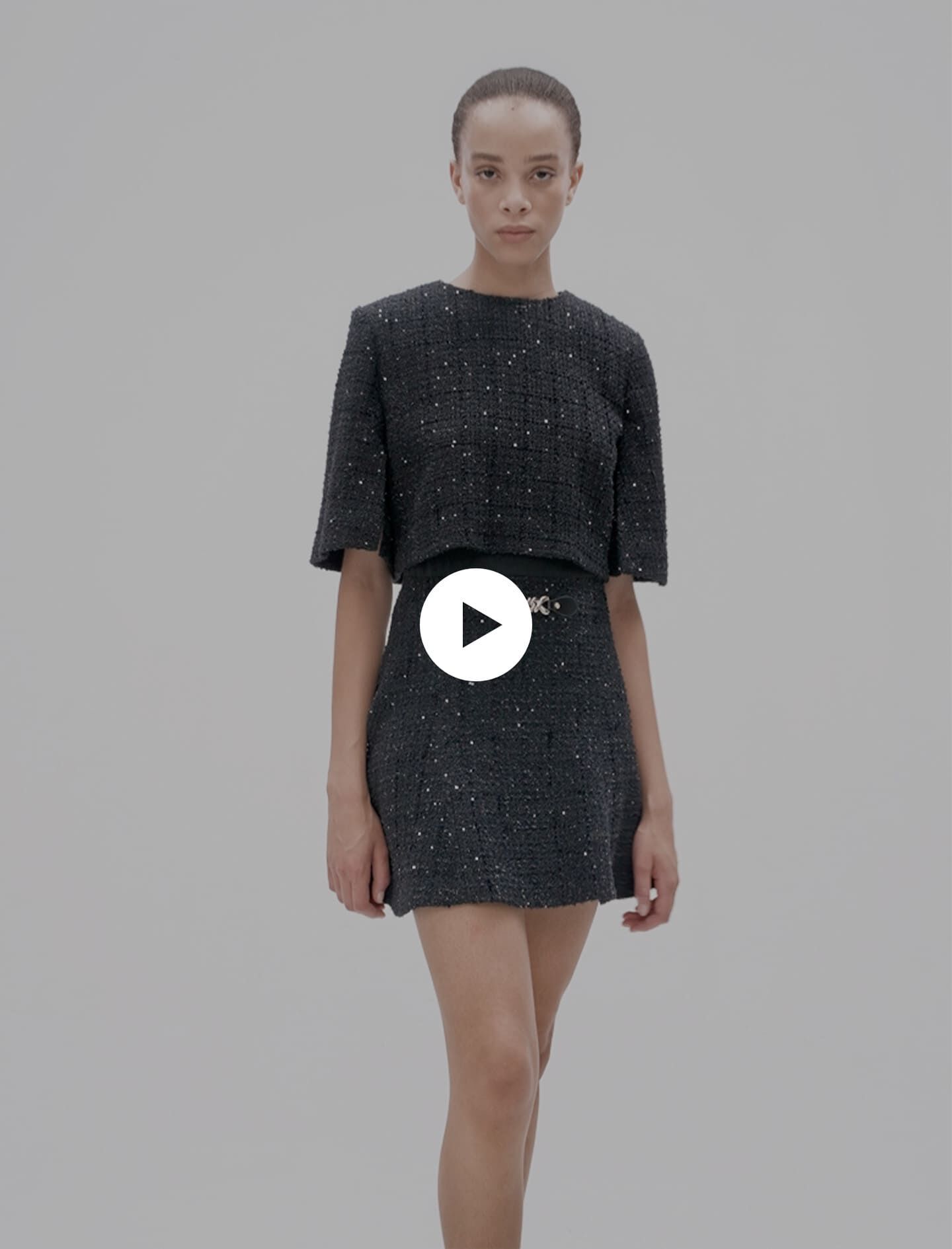 Short tweed dress with accentuated waist