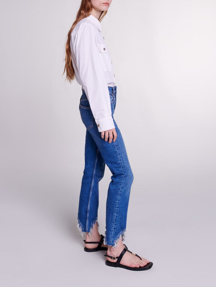 Slim-fit jeans, ripped at the bottom