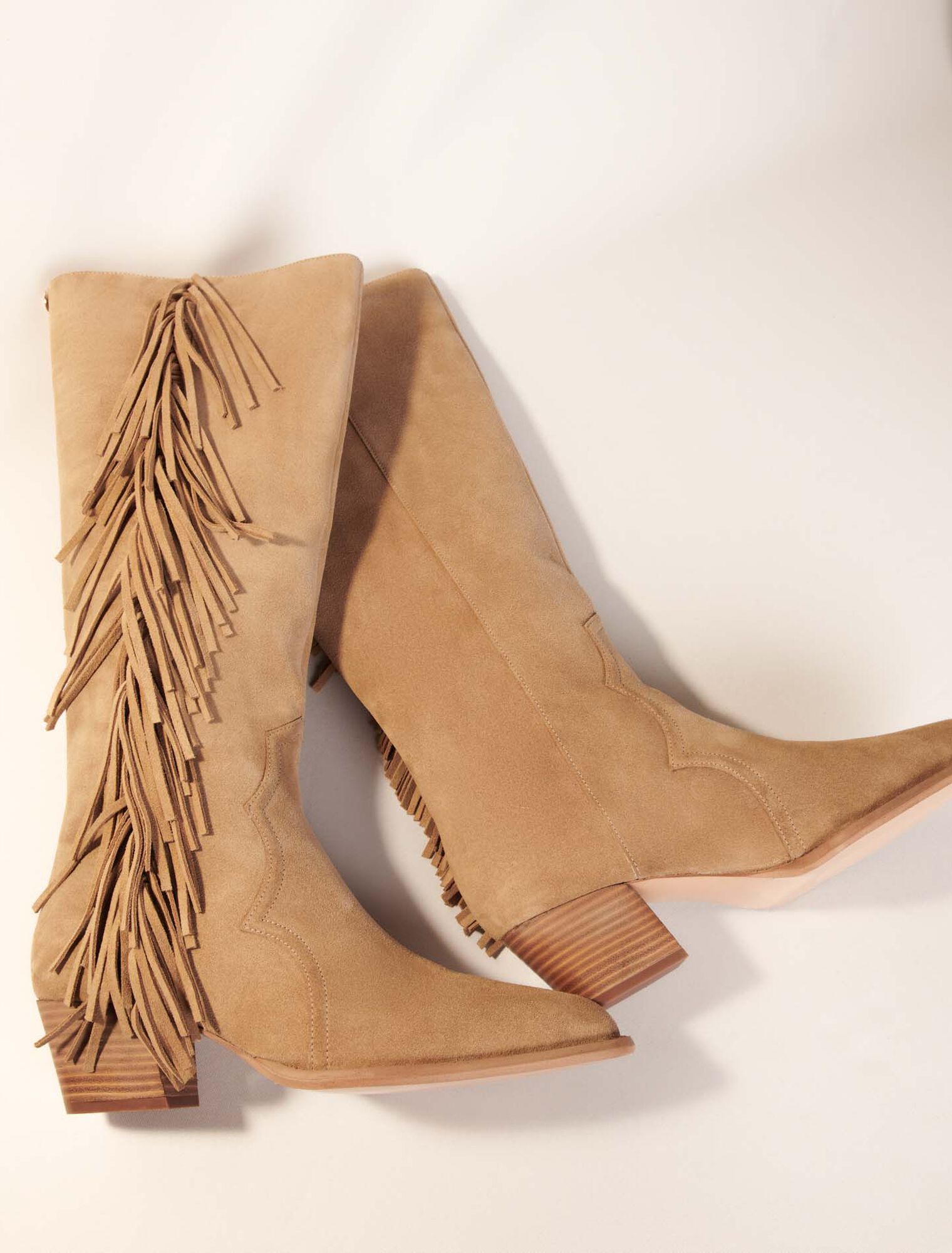 Fringed suede cowboy boots