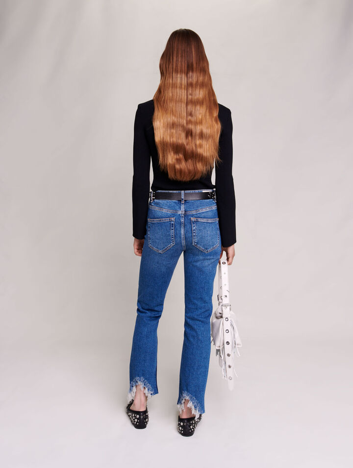 Slim-fit jeans, ripped at the bottom