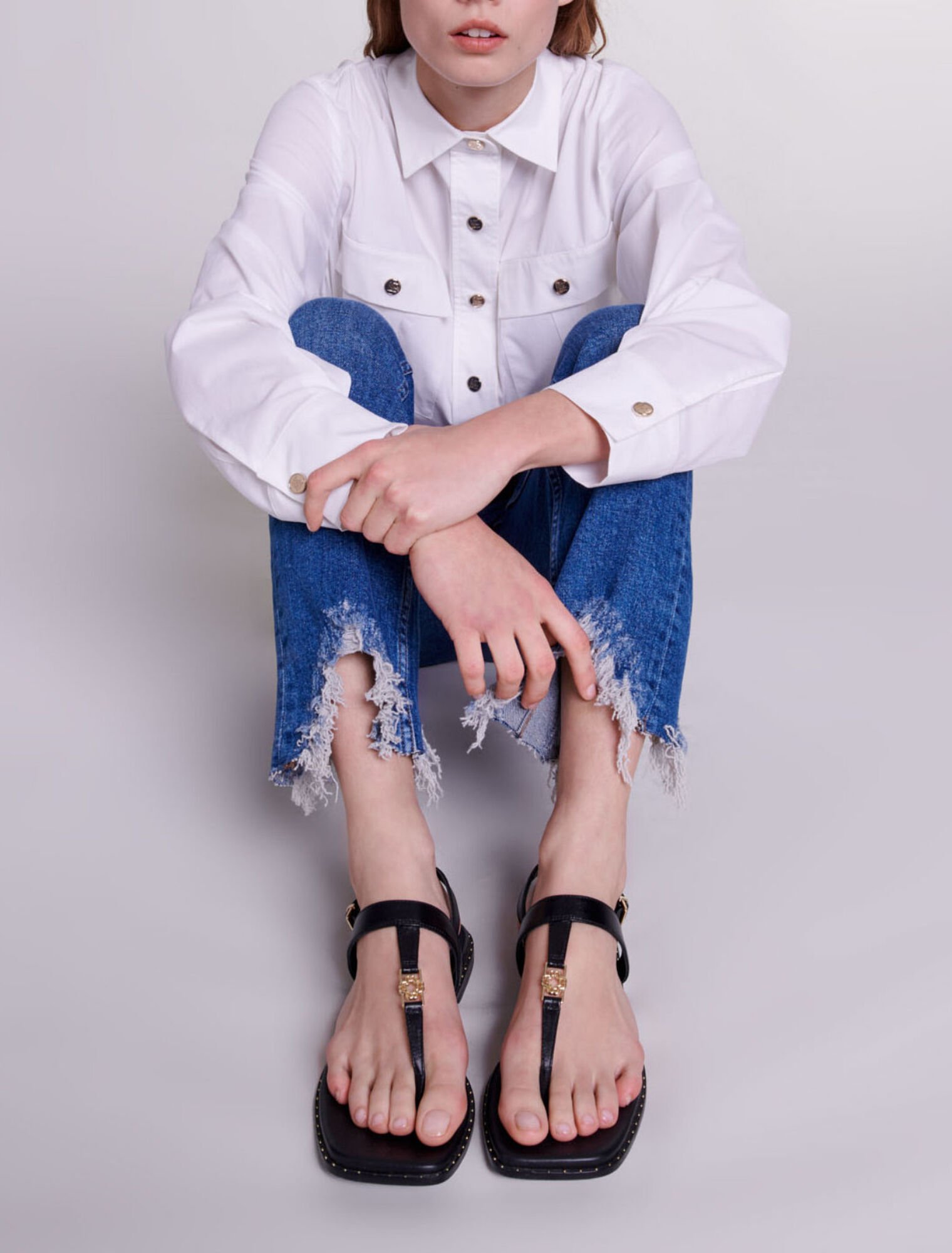 Slim-fit jeans, ripped at the bottom