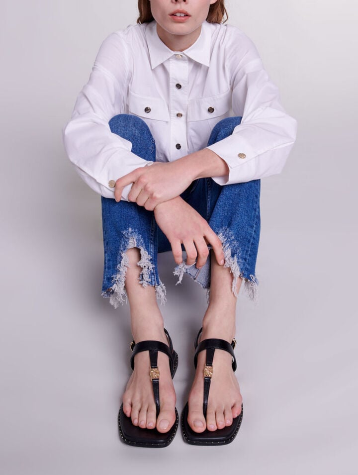 Slim-fit jeans, ripped at the bottom